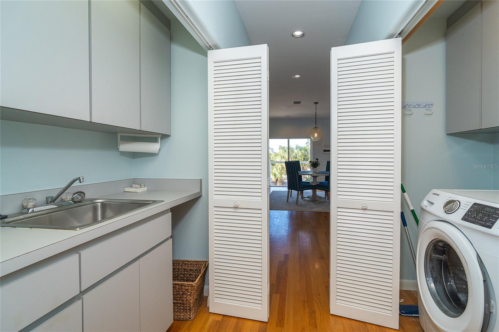 Hall with Sink, Storage and Laundry.