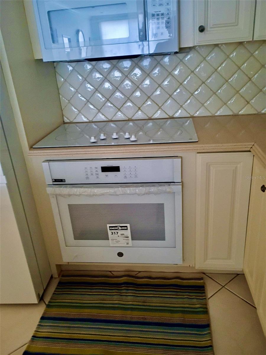 New GE Profile 5-burner cooktop and single oven.