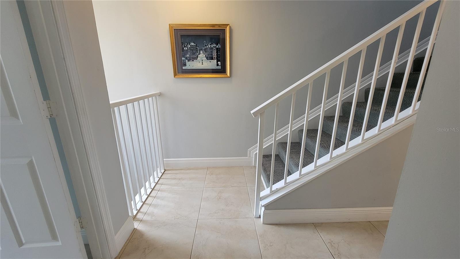 Just outside the 3rd bedroom is the stairway to the 3rd floor primary owners suite and 2nd bedroom