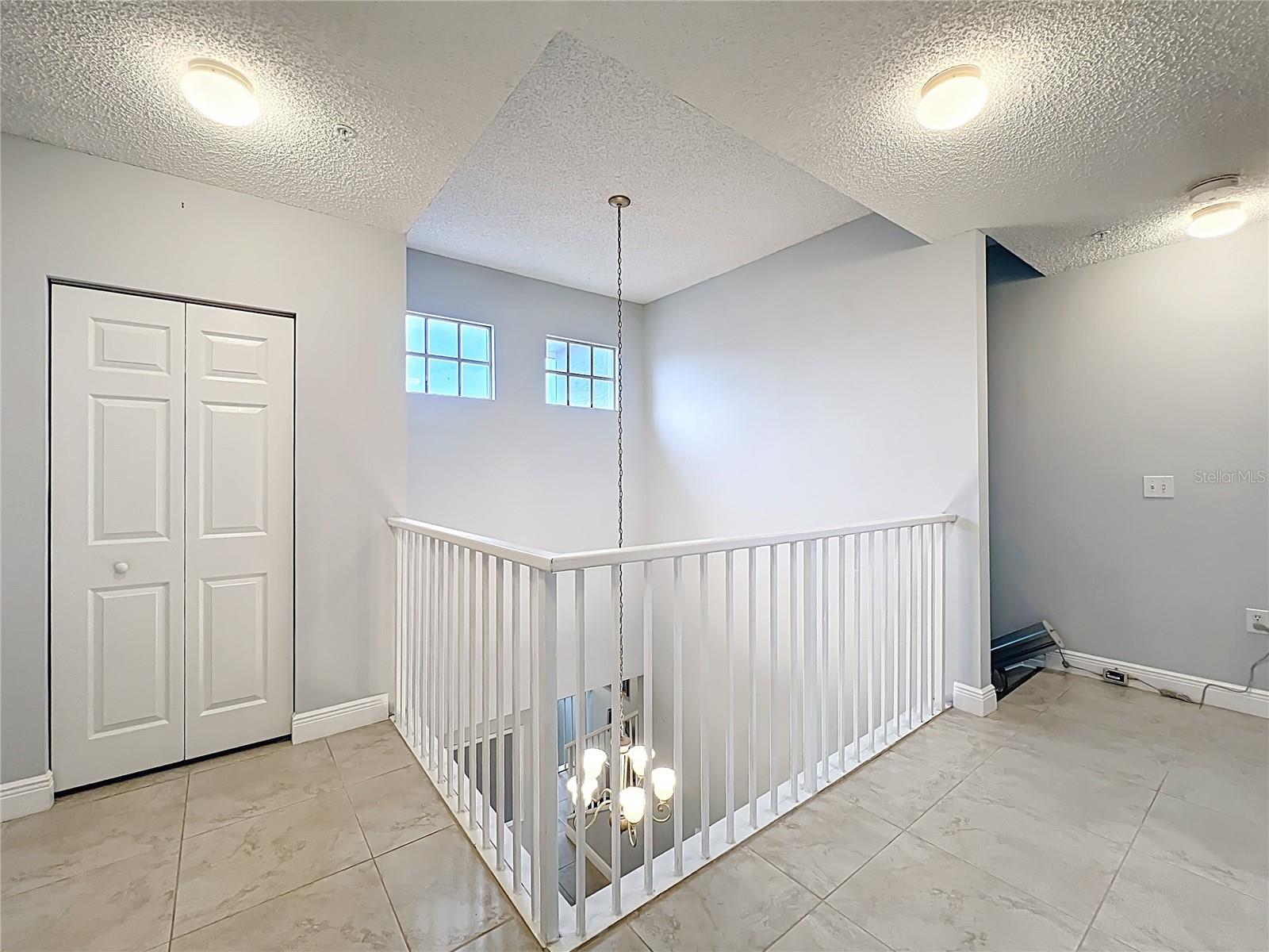 The catwalk connects the 2nd bedroom, primary bedroom with ensuite bath.