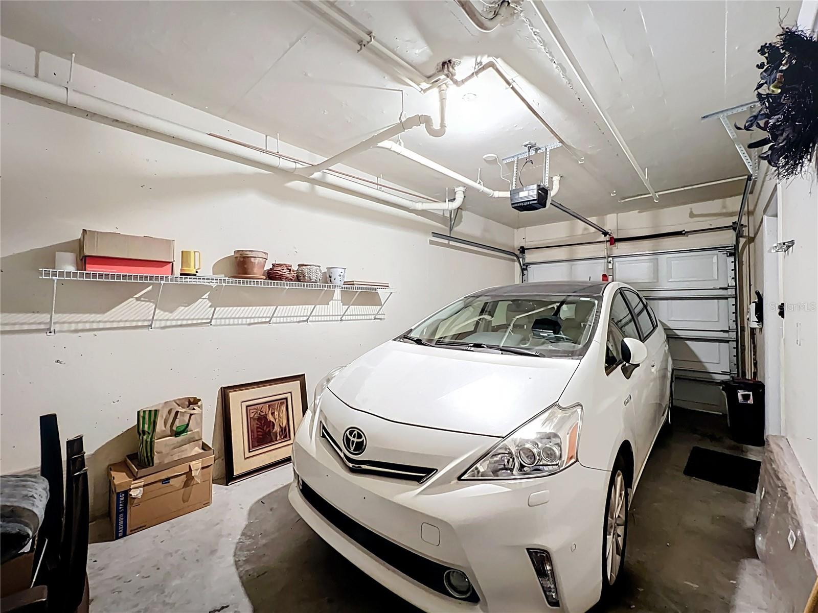 Back at ground level is the one-car garage  allowing for extra storage