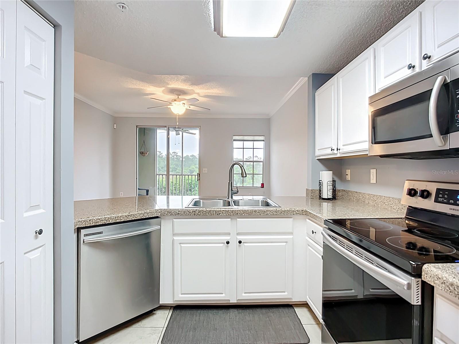 Breakfast bar between kitchen and living room