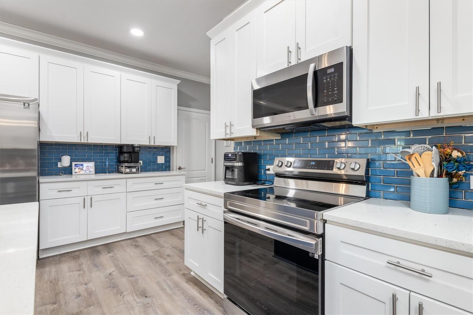 Stainless steel appliances in kitchen.