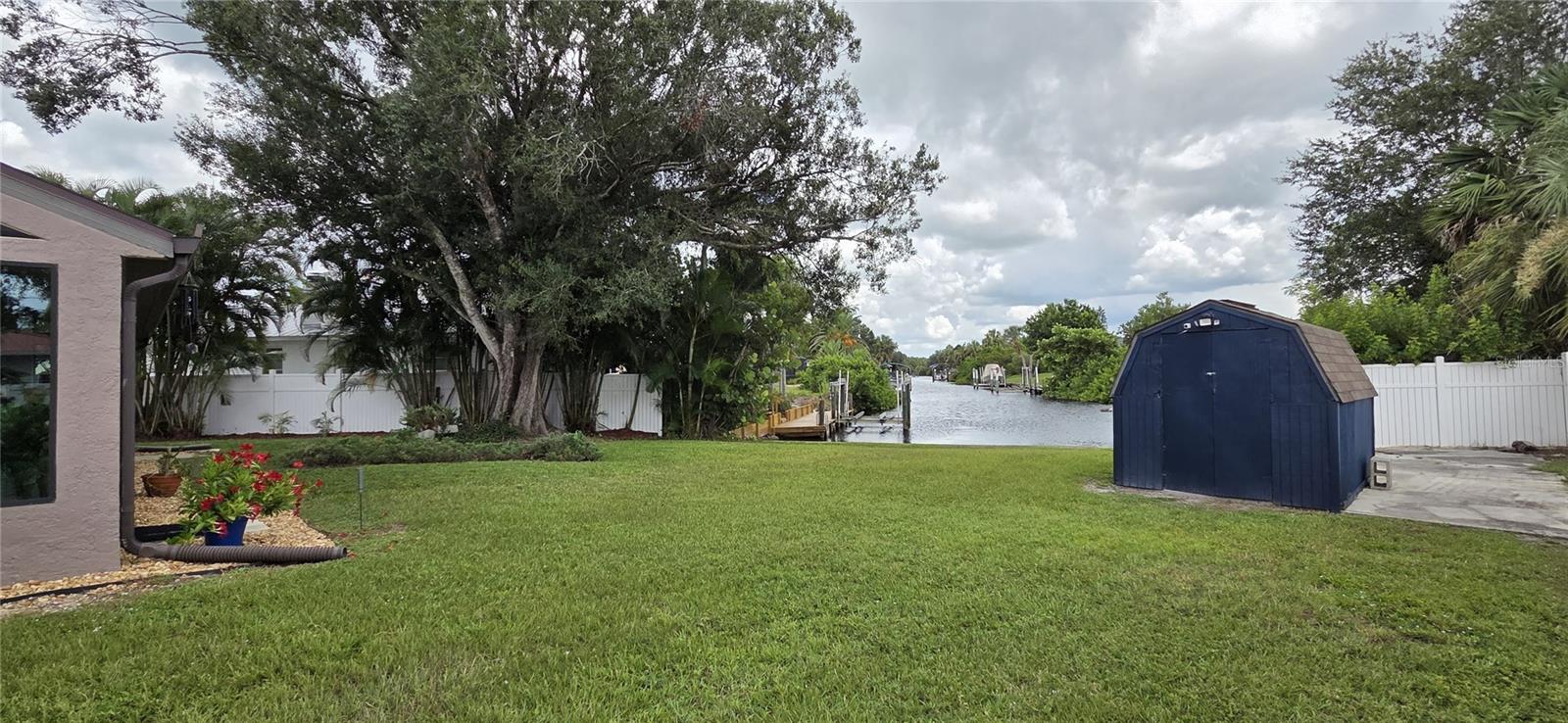 Back yard facing shed and waterway