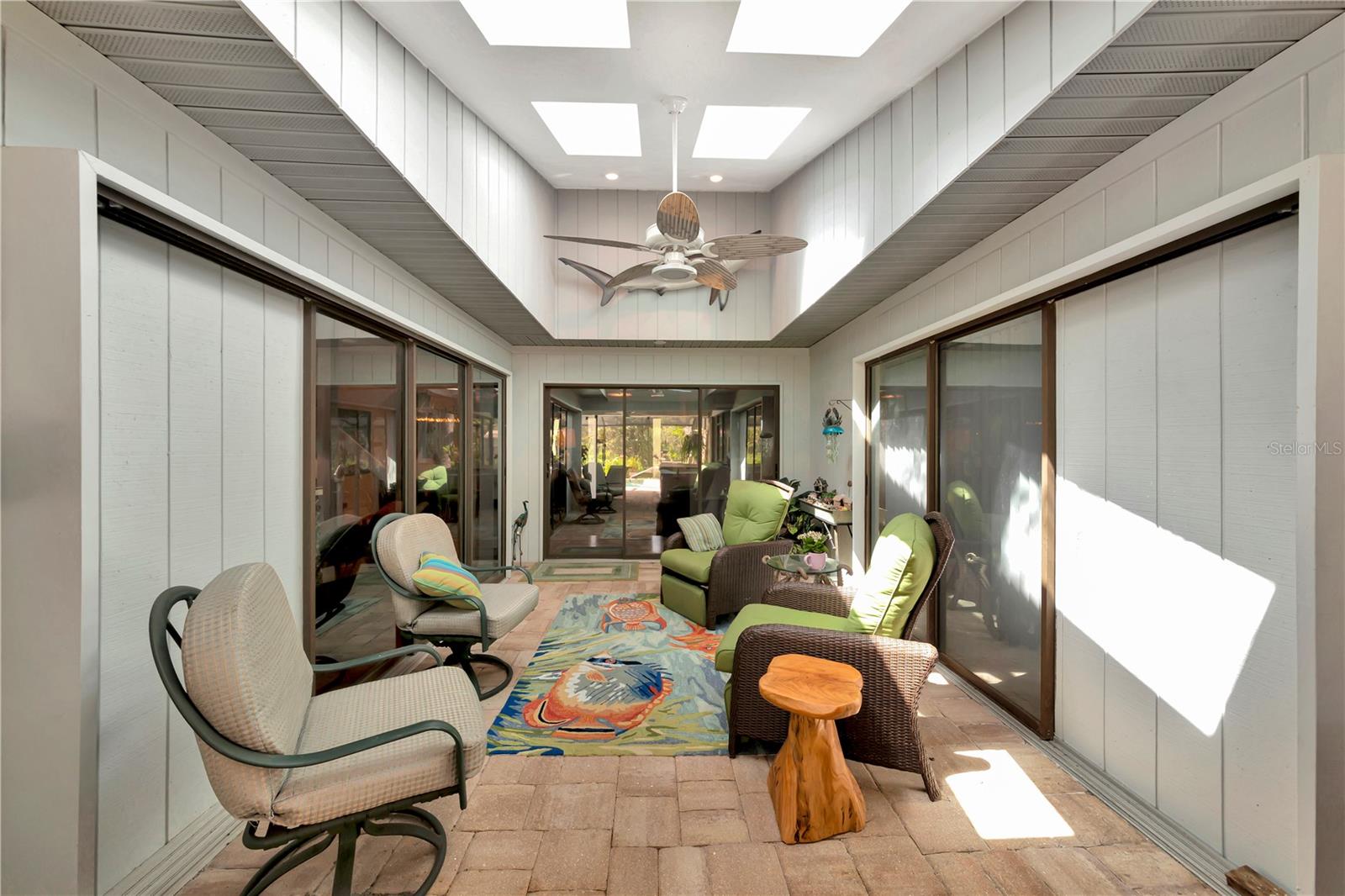 Covered lanai opens to pool