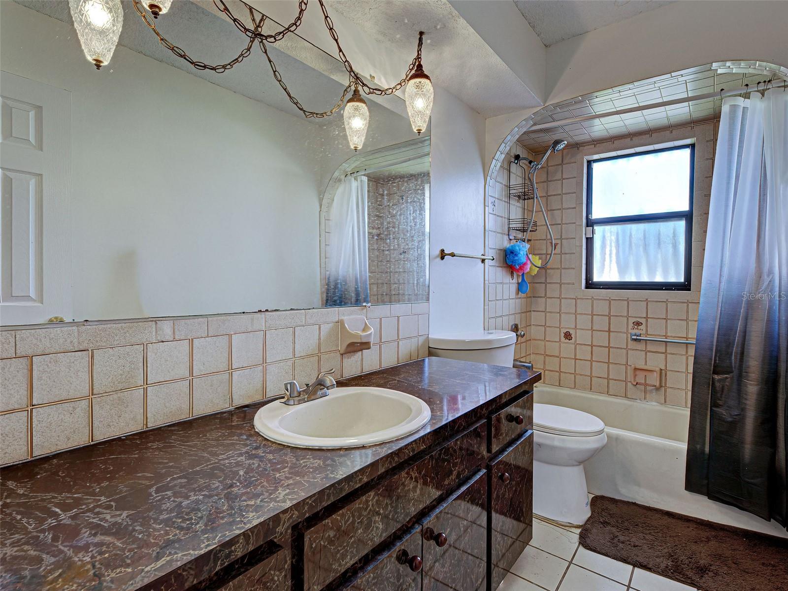 Second bath with TUB/ SHOWER combo.