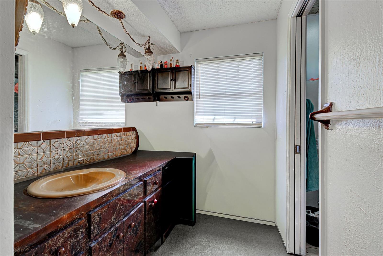 ensuite bath with walk in renovated shower.