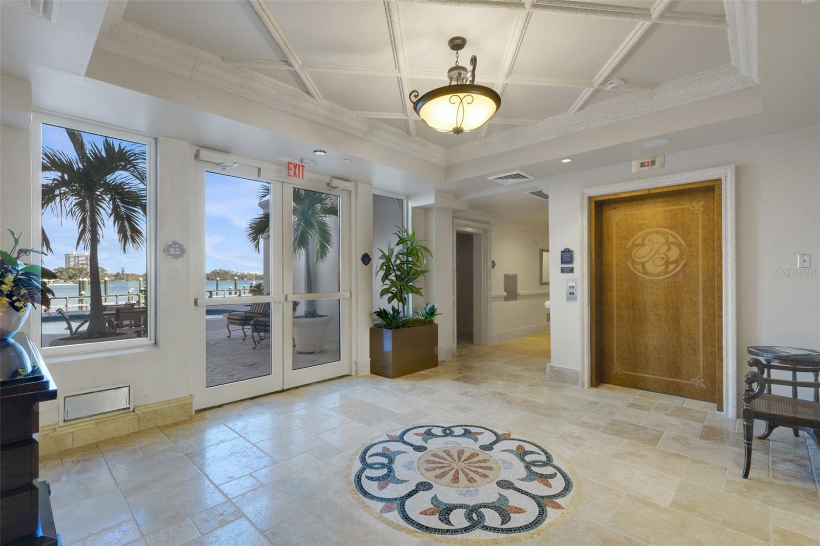 Pool Access and Hallway to Private Elevators and Deeded Garage