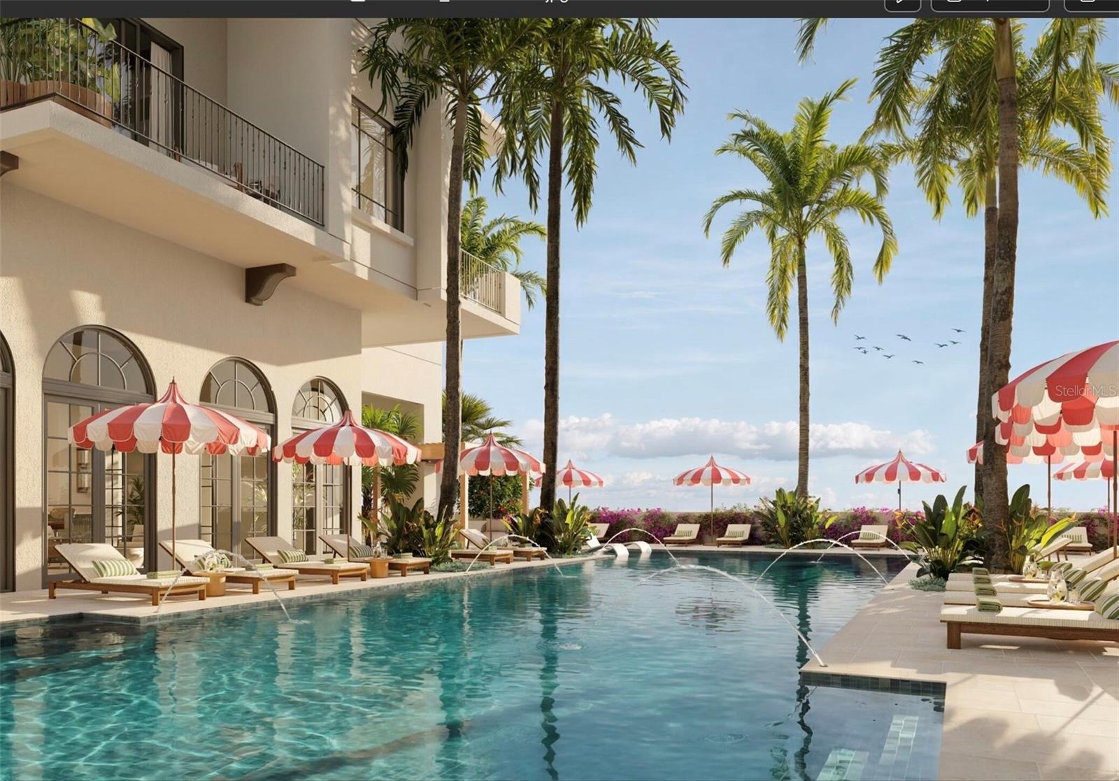 The 70-foot resort-style pool at Mira Mar is complemented by a lounging area with  a spacious sun deck, hot tub, and dedicated towel service, creating a luxurious setting for relaxation and leisure.