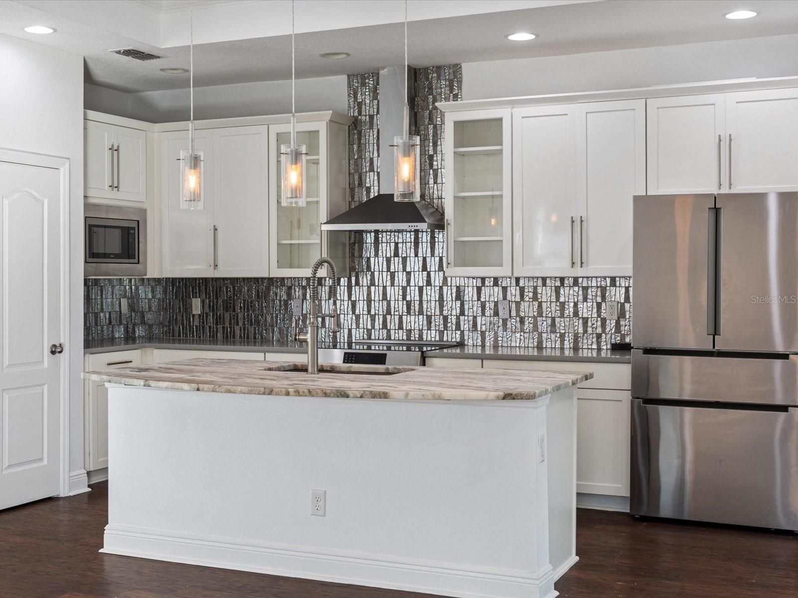 Kitchen with lovely tile backsplash