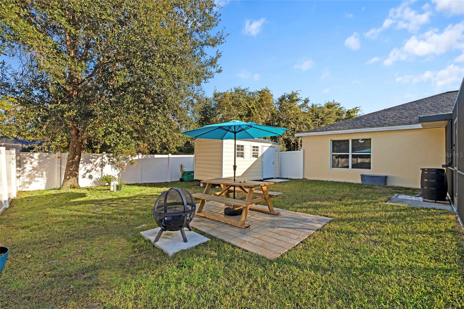 Backyard Showing Picnic Area and Firepit