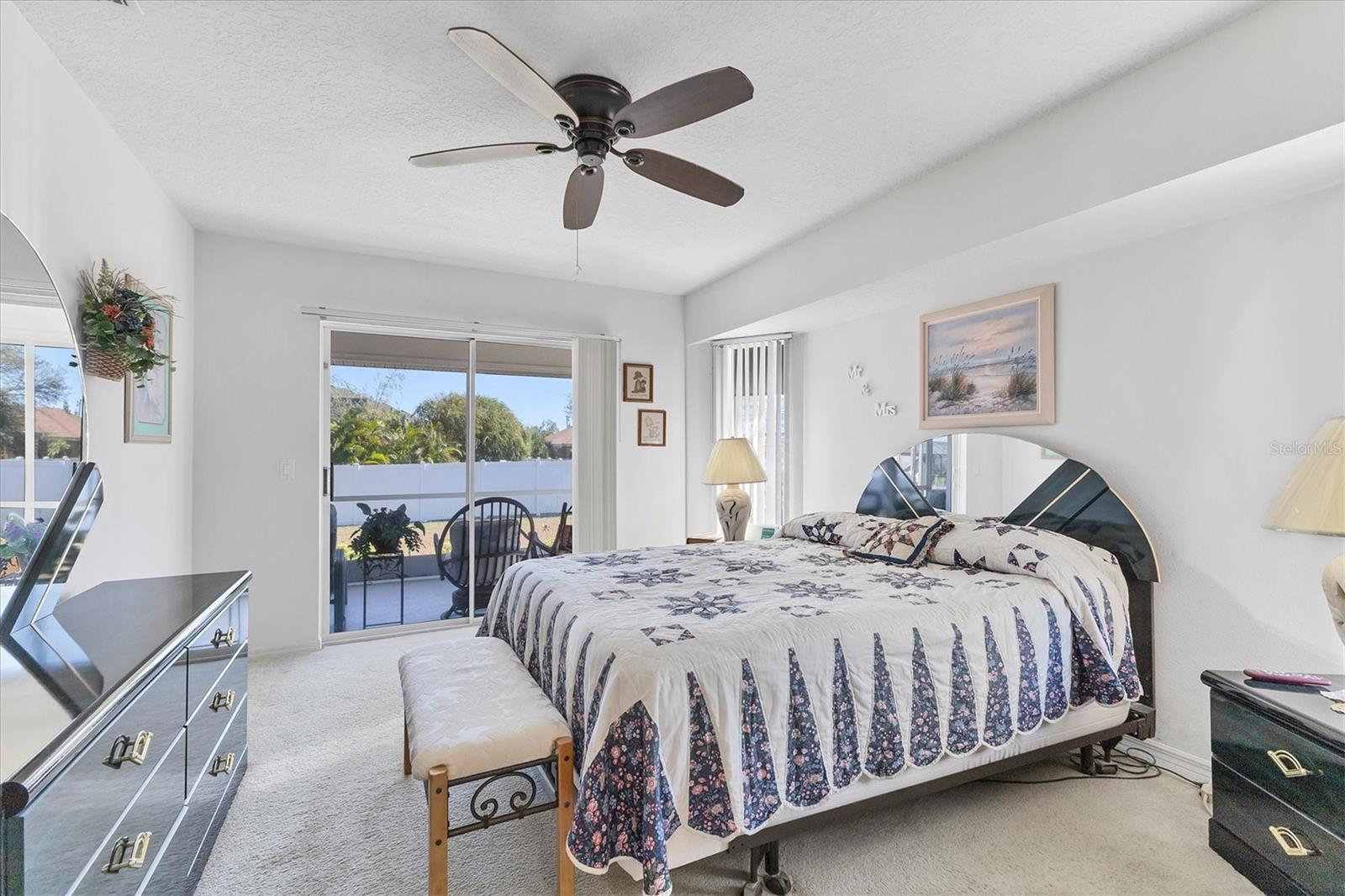 Primary bedroom with slider to lanai
