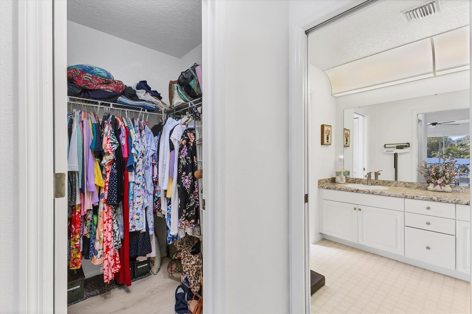 Walk-in closet, primary bathroom