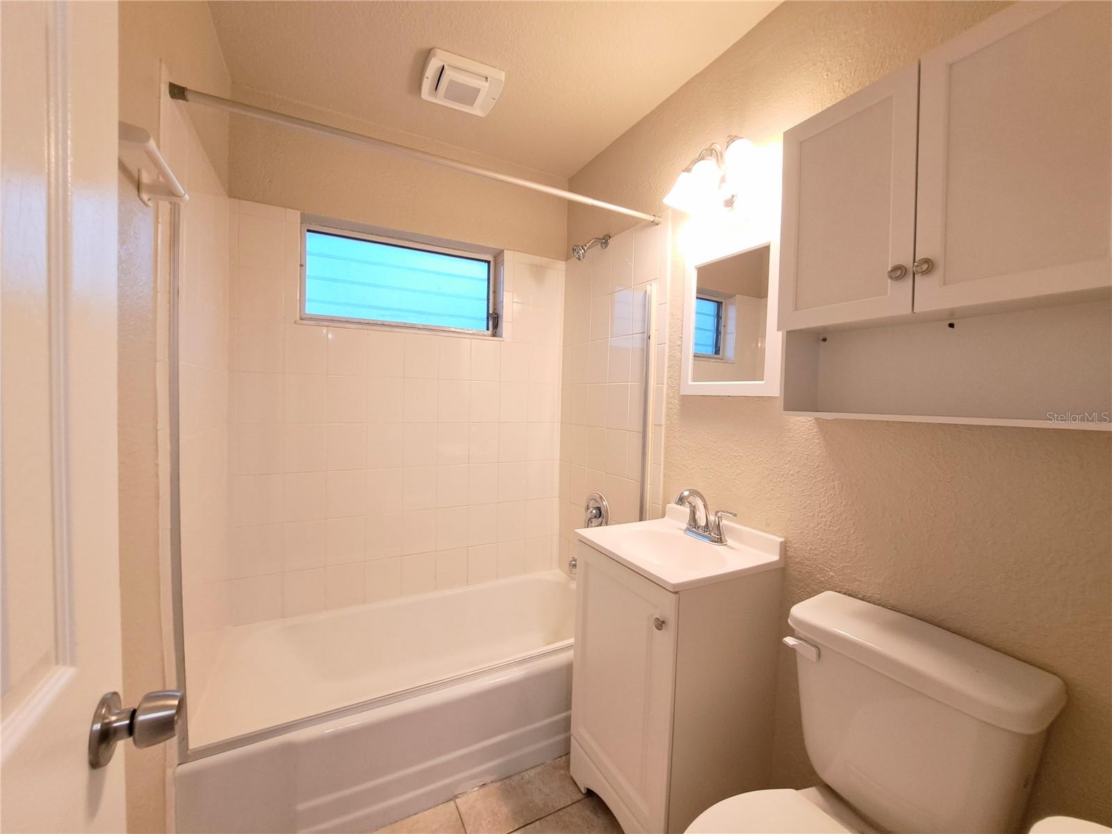 Guest Bathroom. Full Bathroom with shower tub combo.