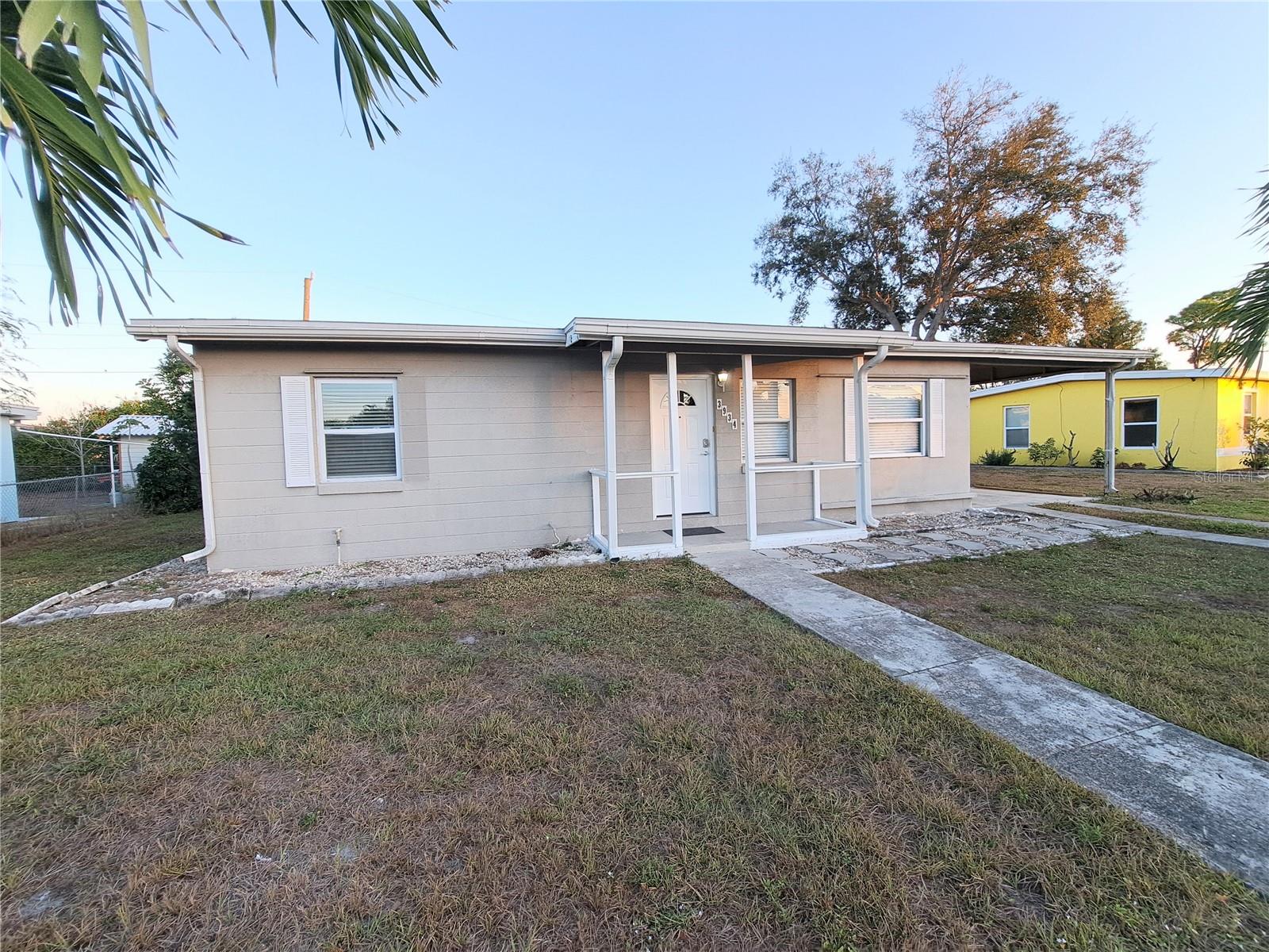 3/1.5/1 car carport. Partially fenced, sidewalks, walk ways and more,