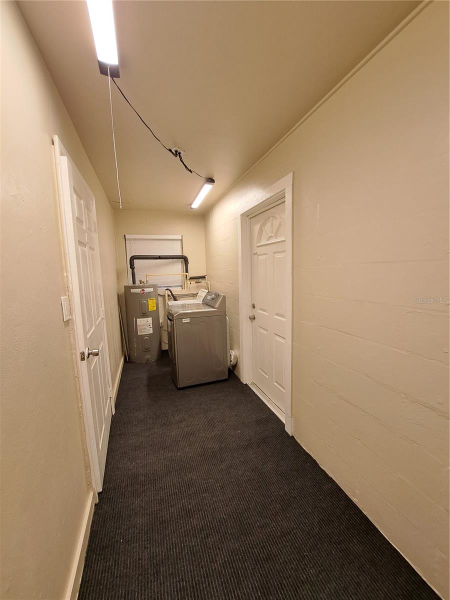 Laundry and Utility room. Tons of storage and organization space. Located off Primary Bedroom with exterior access.