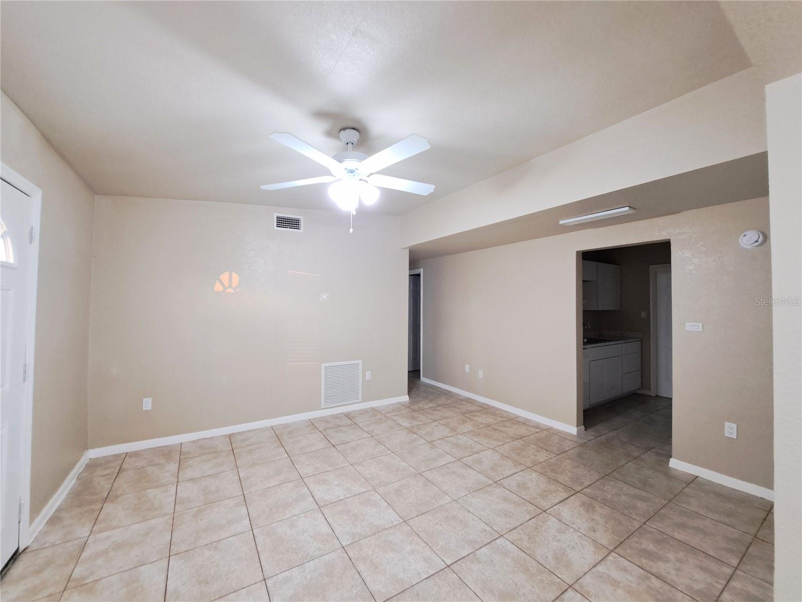 Main, Front Living space looking at the Kitchen Entrance and hallway to two Bedrooms and two bathrooms plus.