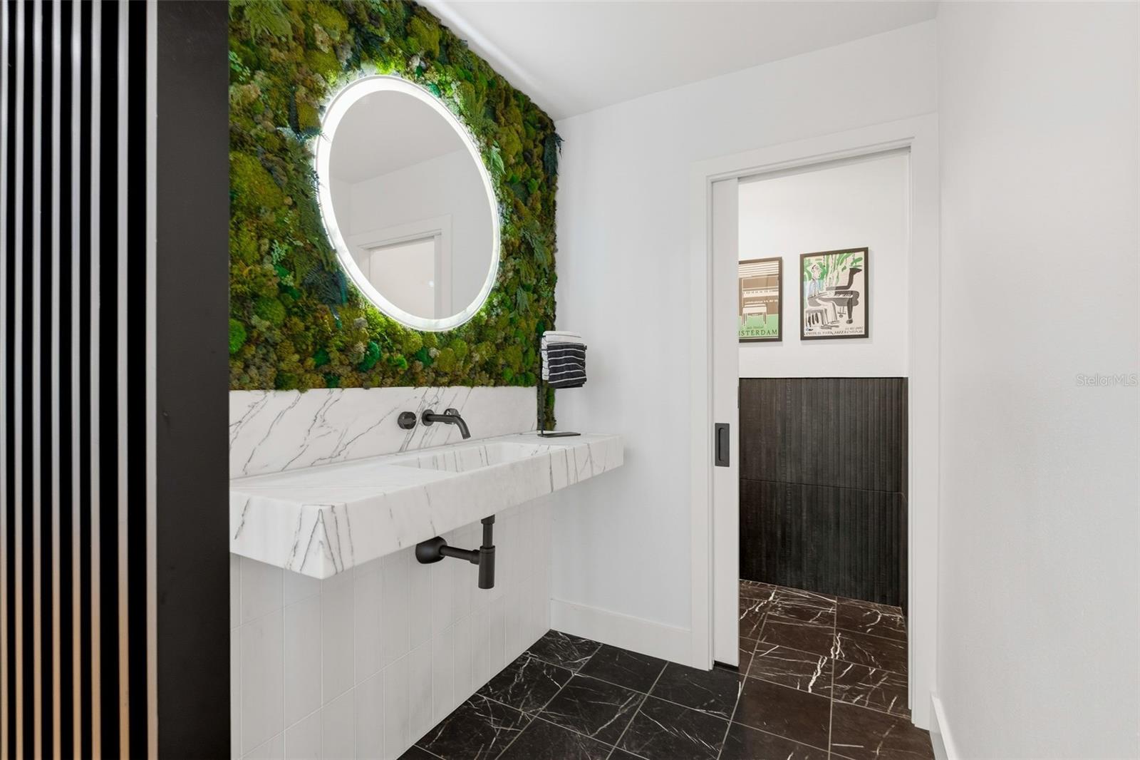 Unique live moss wall at half bath