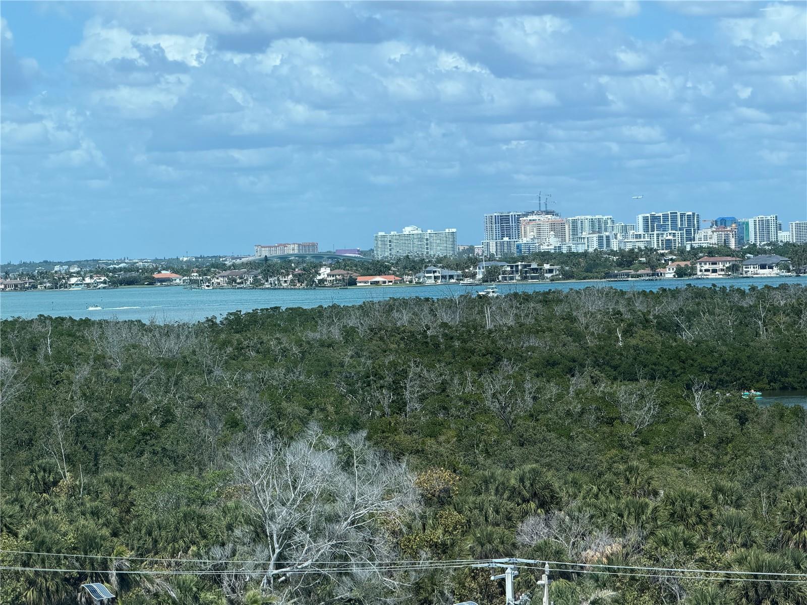 LOOK TO THE NORTH AND SEE SARASOTA BAY, CITY OF SARASOTA AND THE RINGLING BRIDGE.