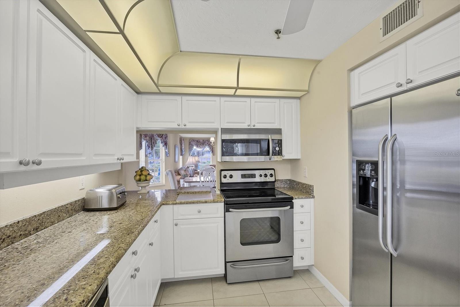 Kitchen is complimented with stainless appliances