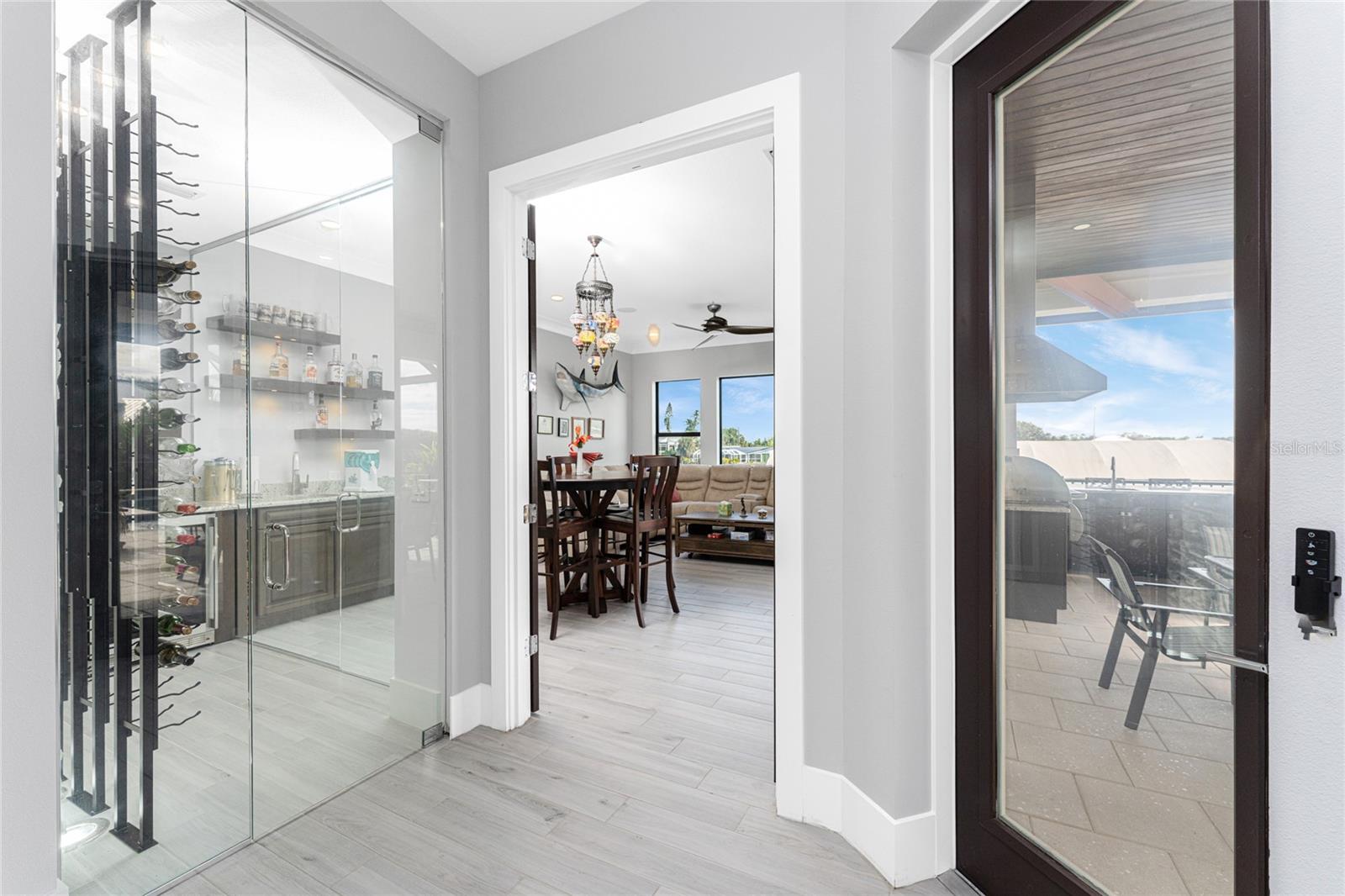 Entry to bonus room ...note glass enclosed wine room and direct access to lanai