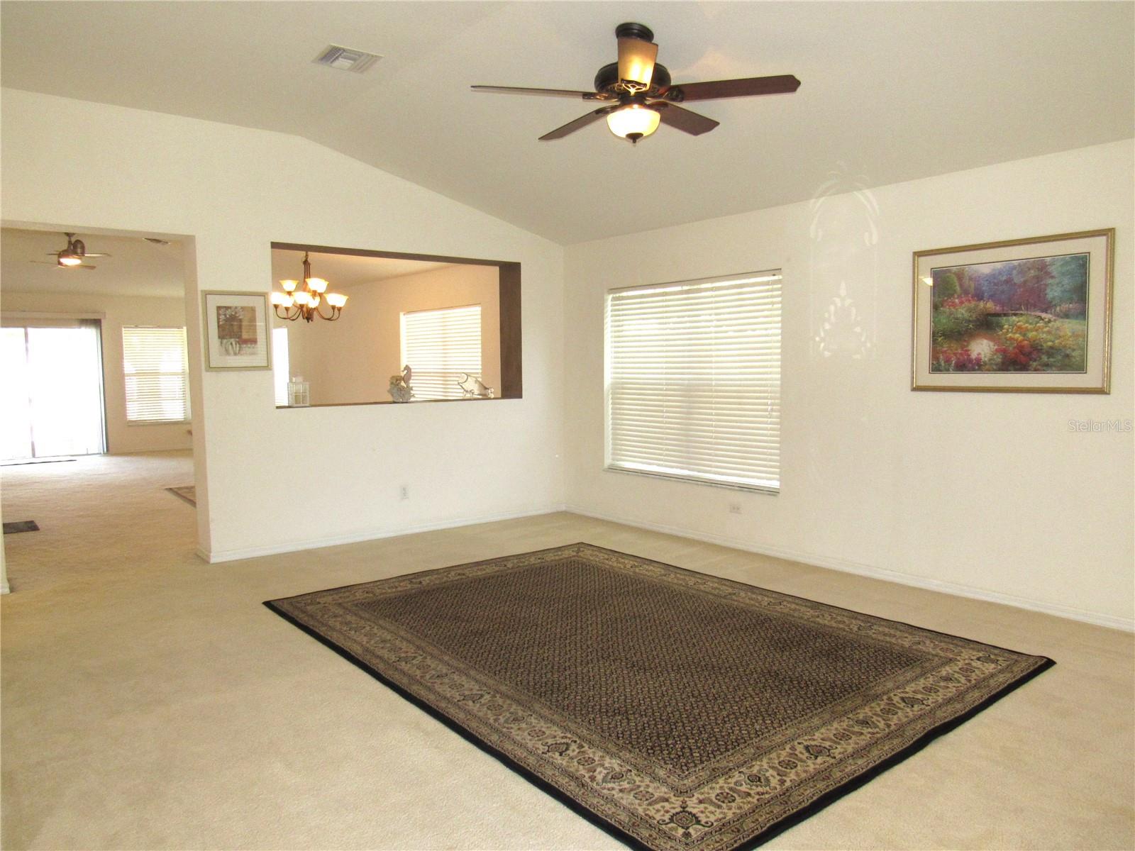 Living room with opening to family/dining room