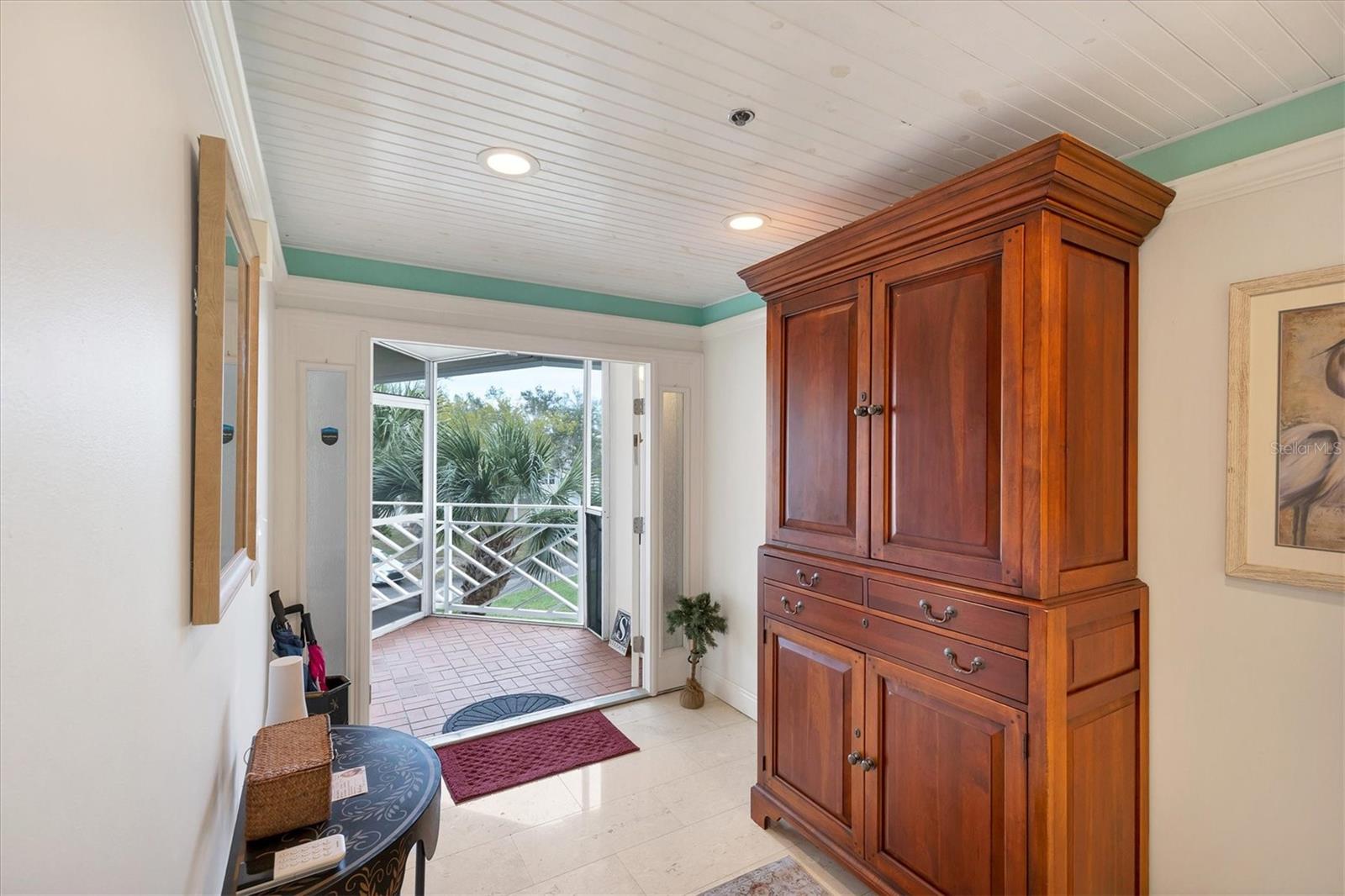 Front porch & double door entrance into foyer
