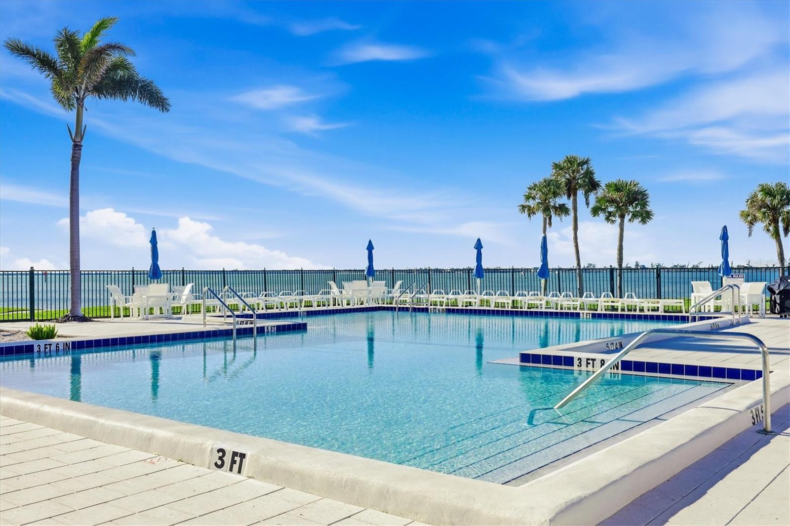 Relax & unwind in the heated pool while watching boats cruise by