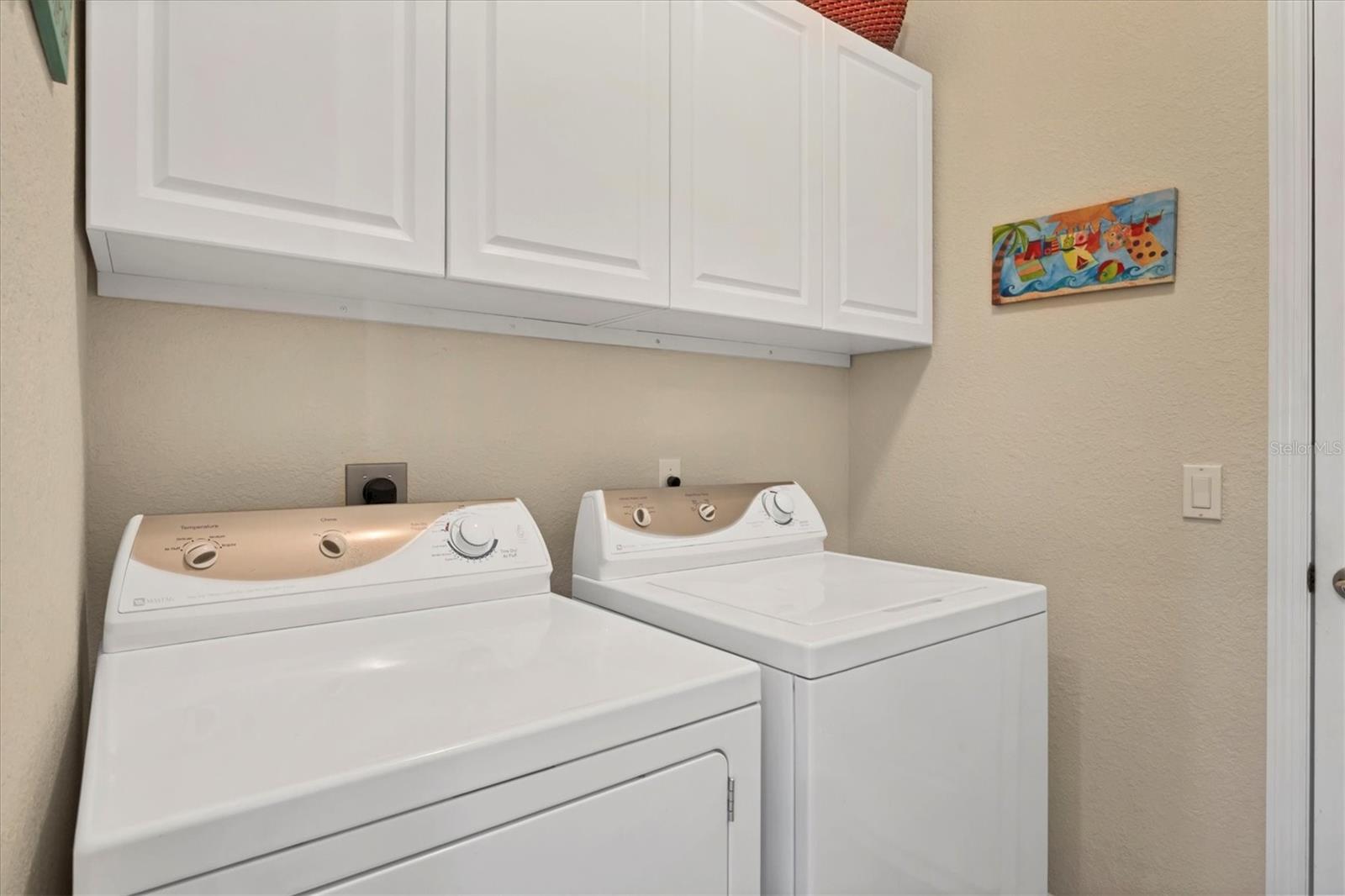 Laundry room off the kitchen and leading to the garage