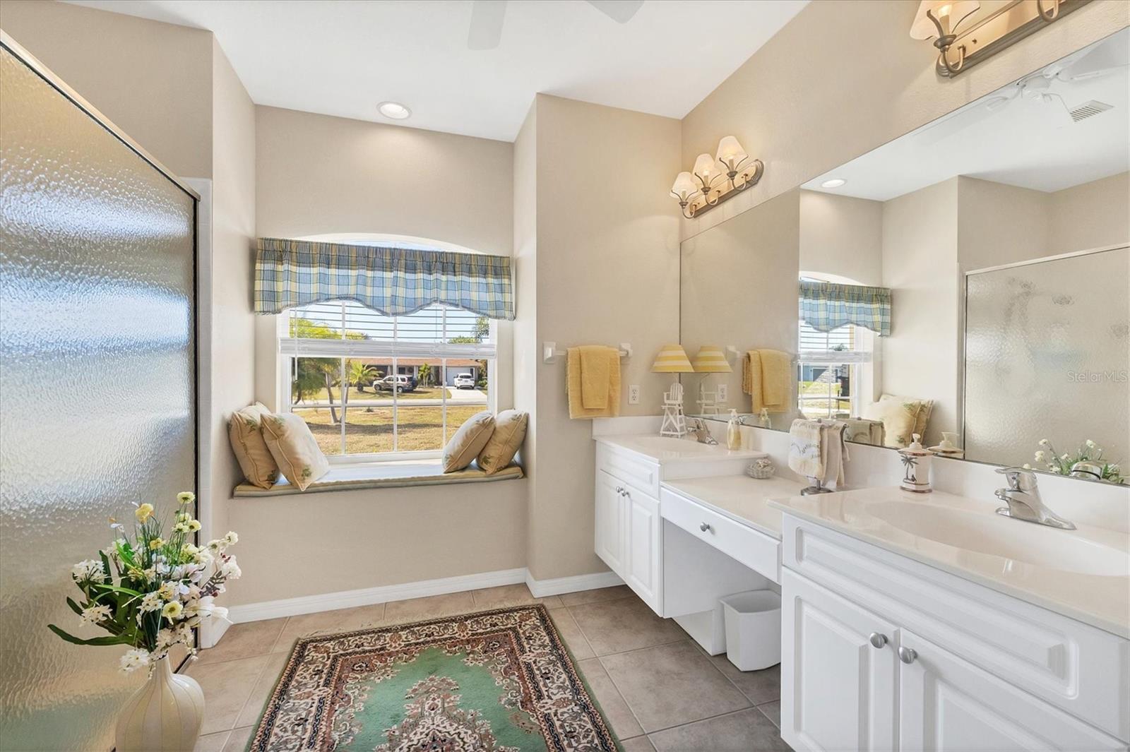Primary Bathroom with walk in shower and separate toilet room.