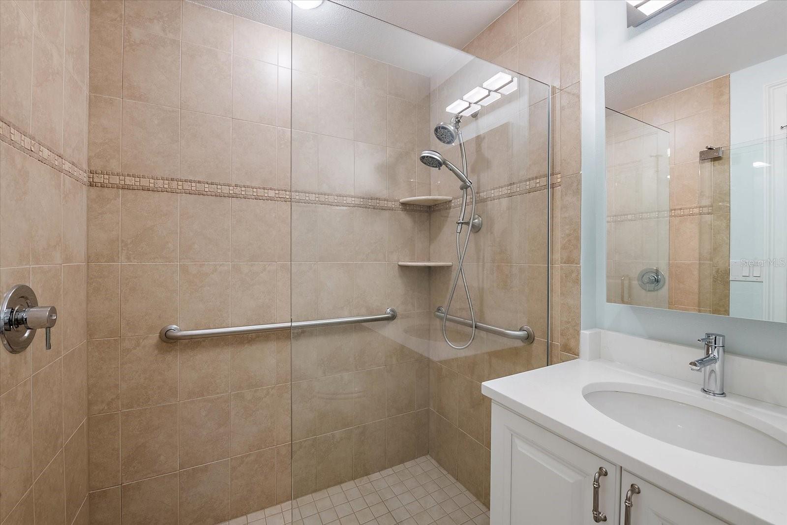Bathroom with walk-in shower and updated vanity