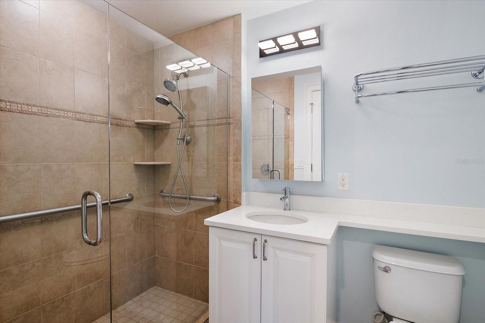 Bathroom with updated cabinetry and countertop