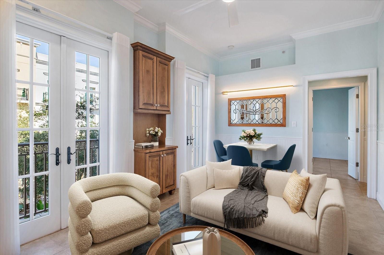 Virtually staged -Living room with natural light and courtyard views