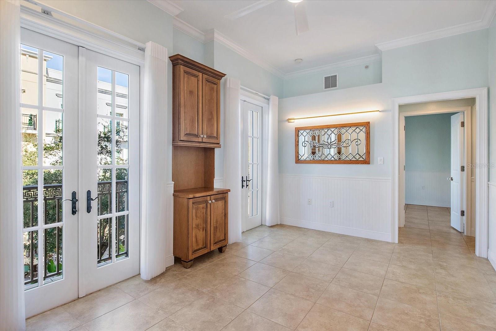 Living room featuring tile flooring and neutral finishes