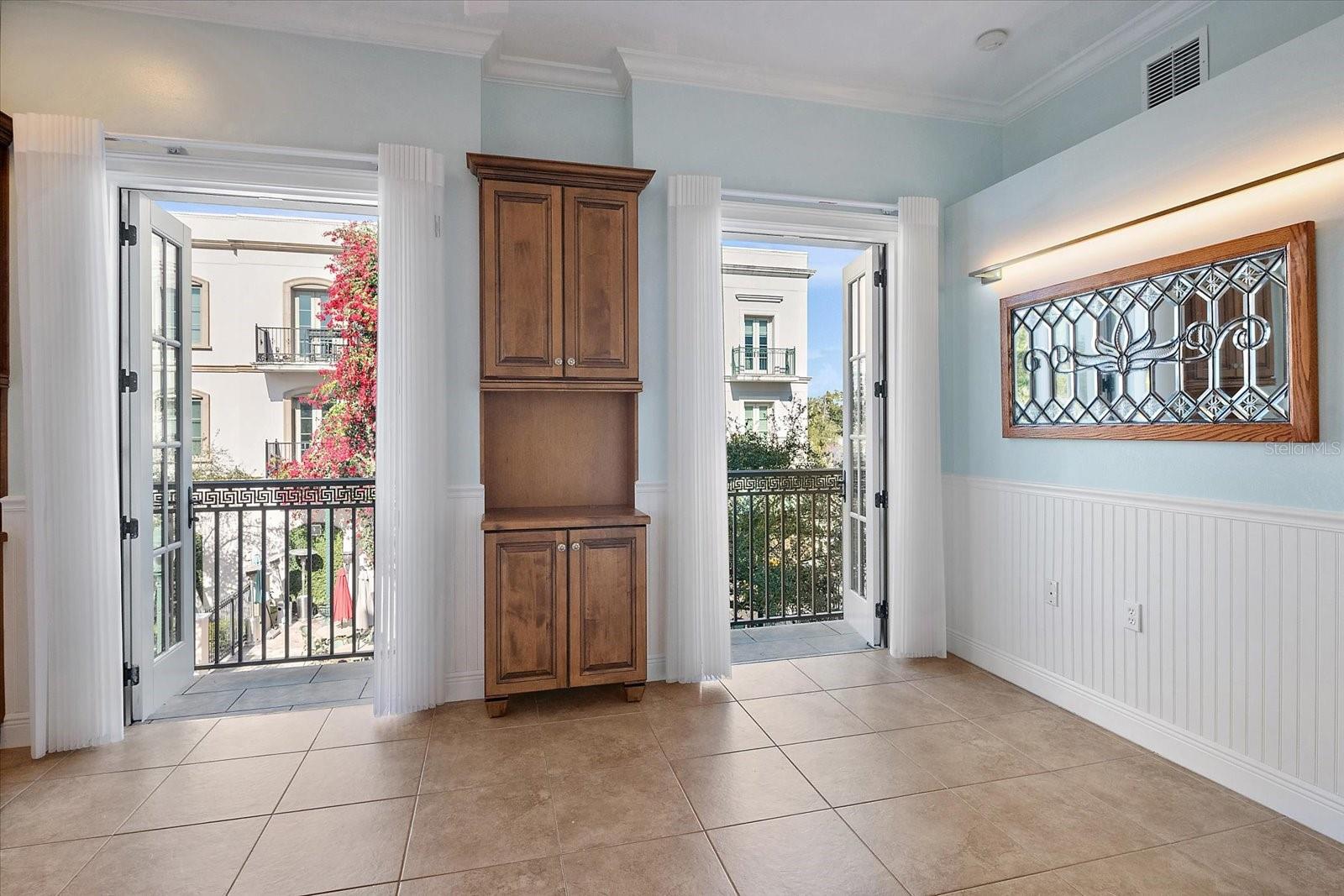 Living space with French doors and courtyard access