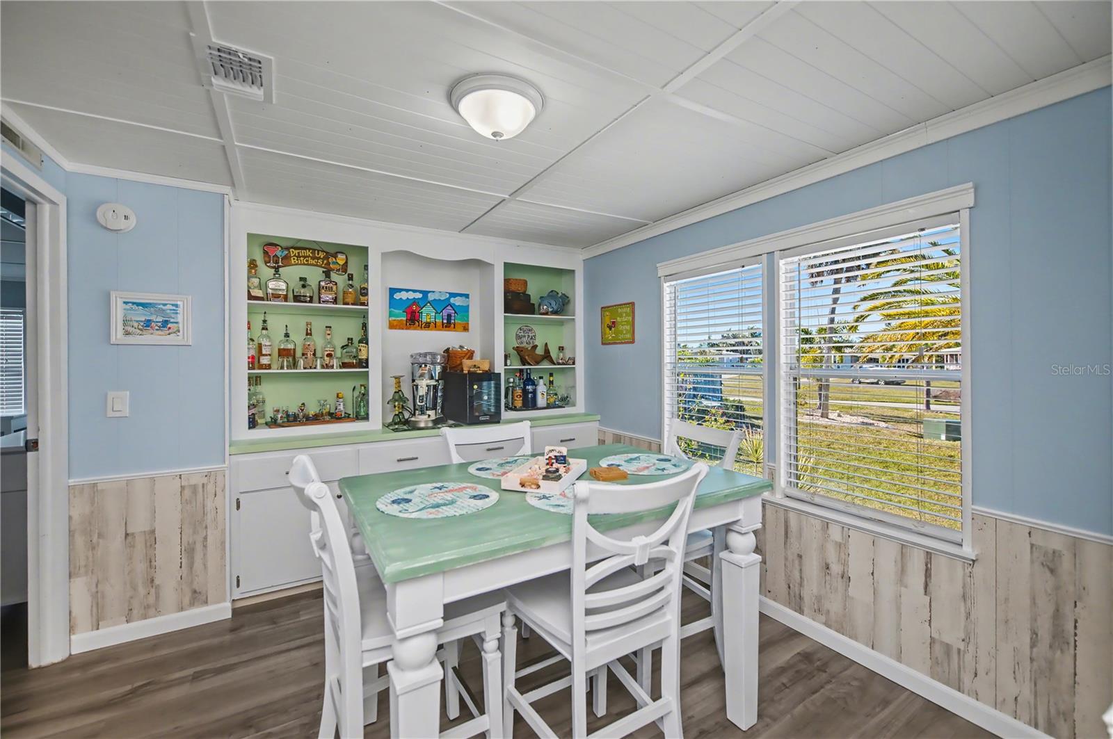 Dining area with large front windows for that delightful natural light.  Plenty of room for larger table to entertain family and friends.