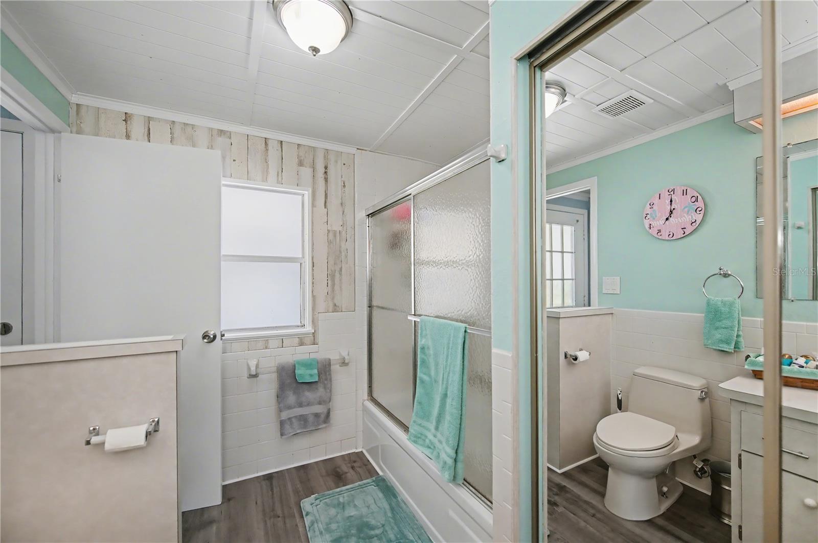 2nd bathroom doubles as a guest bathroom and a private bathroom for the guest bedroom.