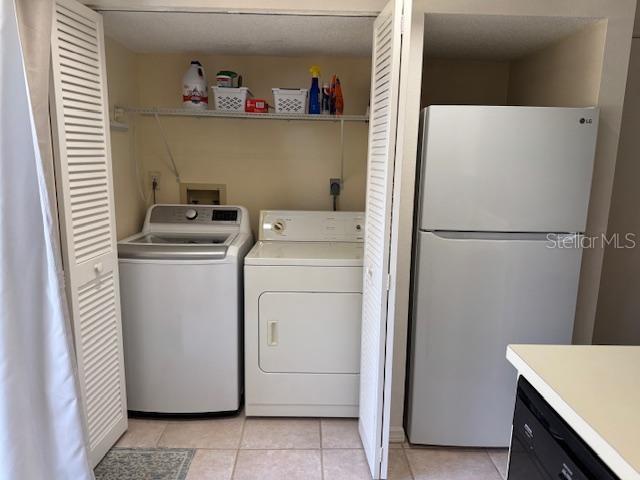 Laundry Closet and Refrigerator in Kitchen