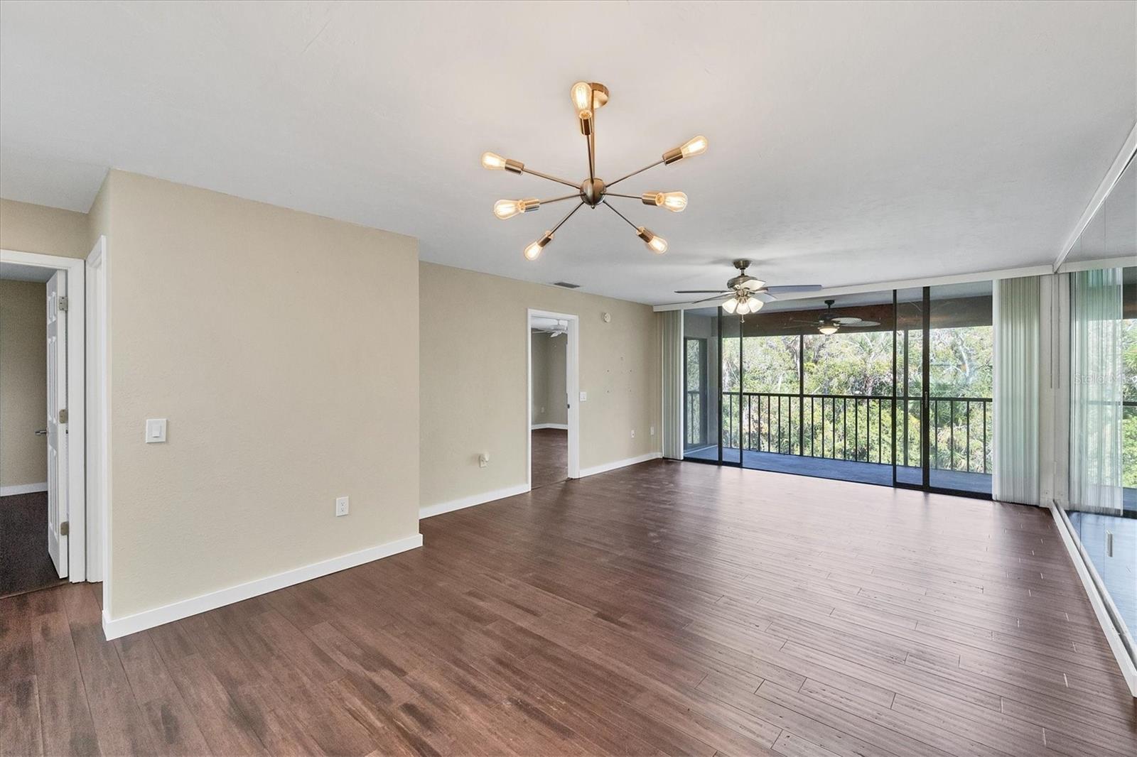 Livingroom to outdoor rear lanai, creek view