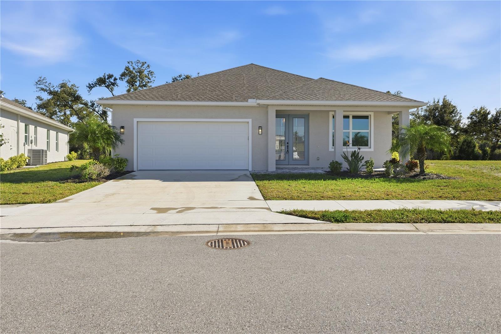 721 Redbud Ct, Englewood, FL 34223 — photo 1 of 51