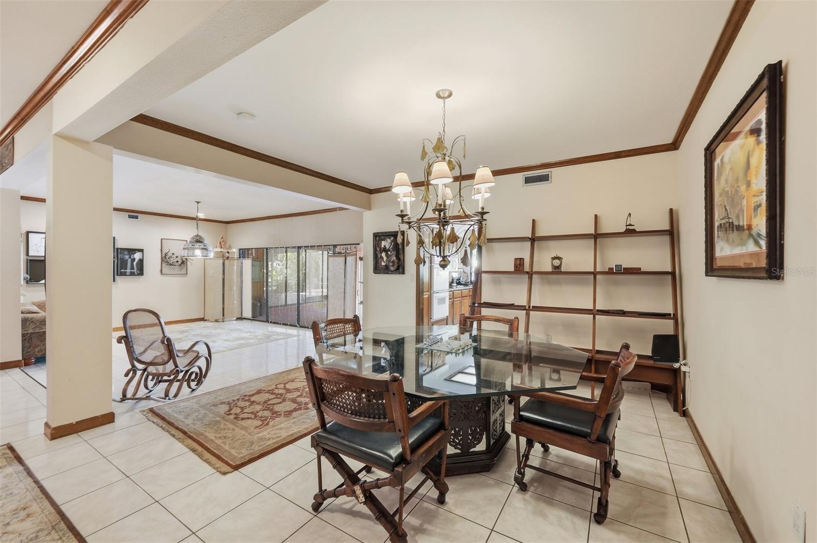 Formal Dining Room Overlooking Spacious Living Room
