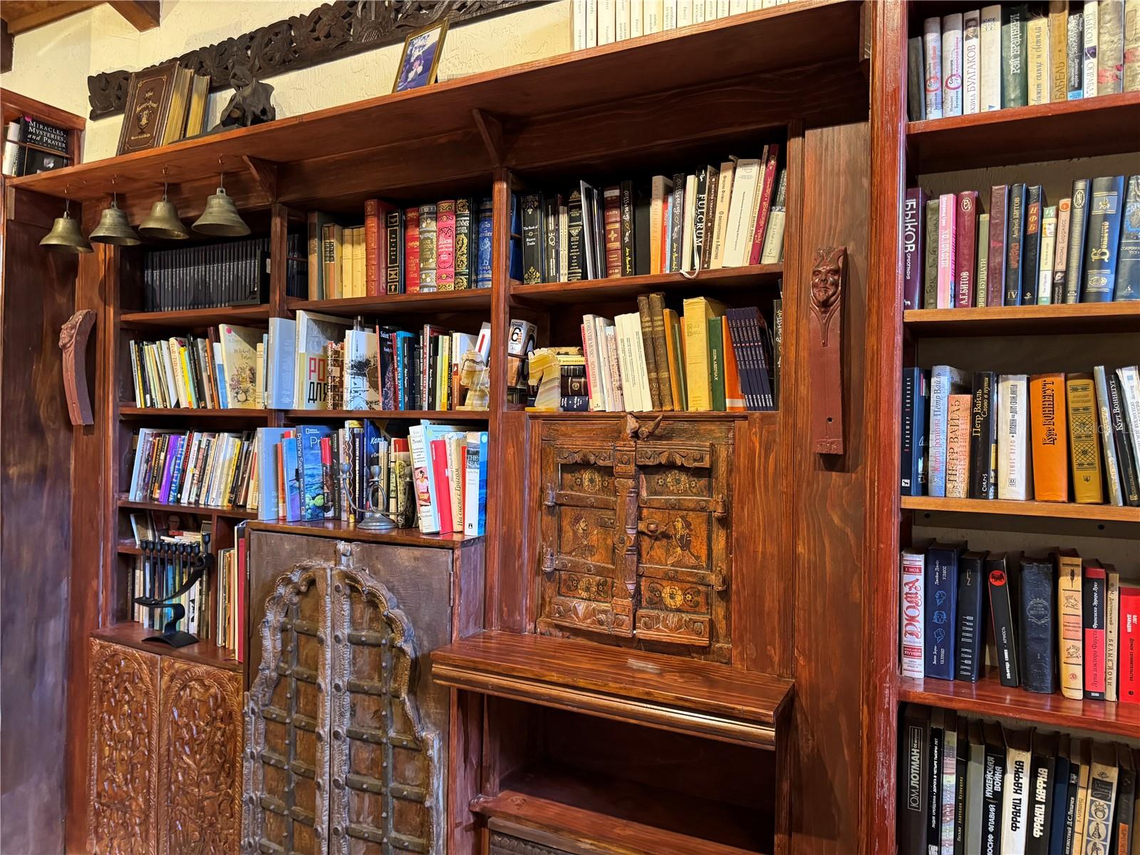 Old World Wood Carvings in Bookcase of Family Room