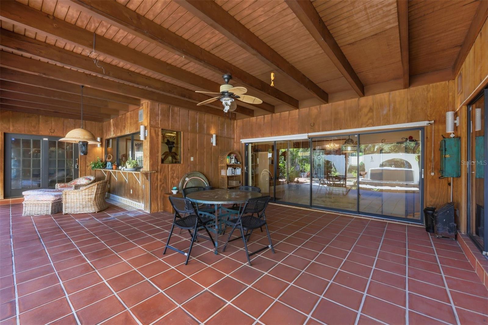 Covered L-Shaped Lanai with Wood Ceiling