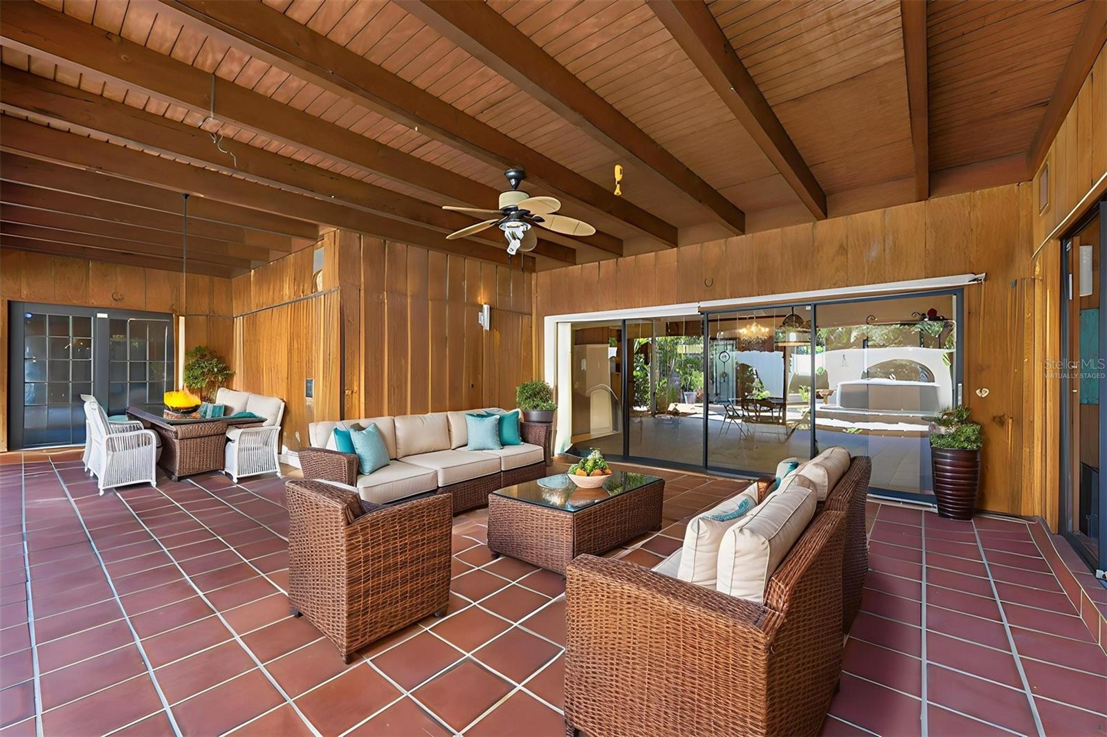 VIRTUALLY STAGED: Covered L-Shaped Lanai with Wood Ceiling