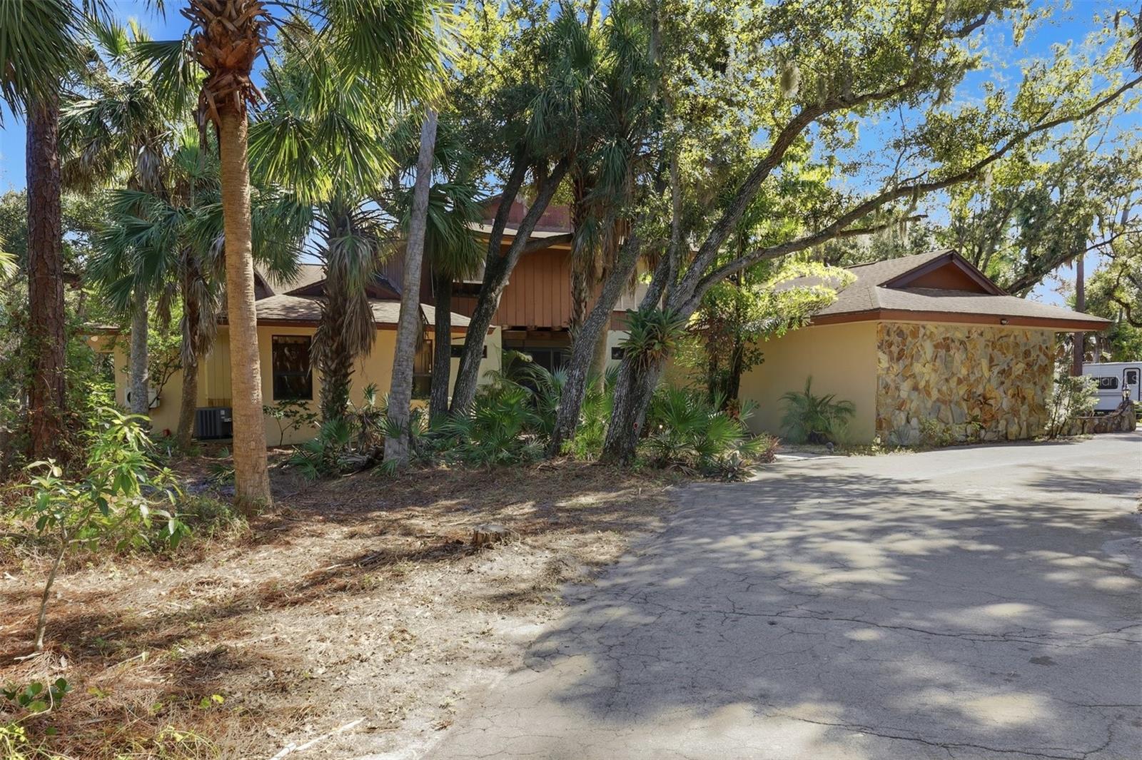 Front of House Nestled in the Trees
