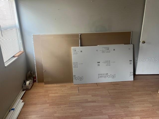 Primary bedroom with supplies on site for a bathroom remodel.