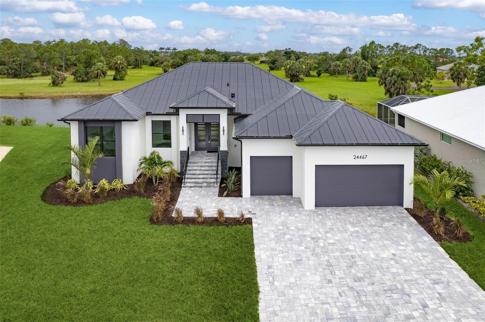 Front elevation of similar home with added 3rd garage door.