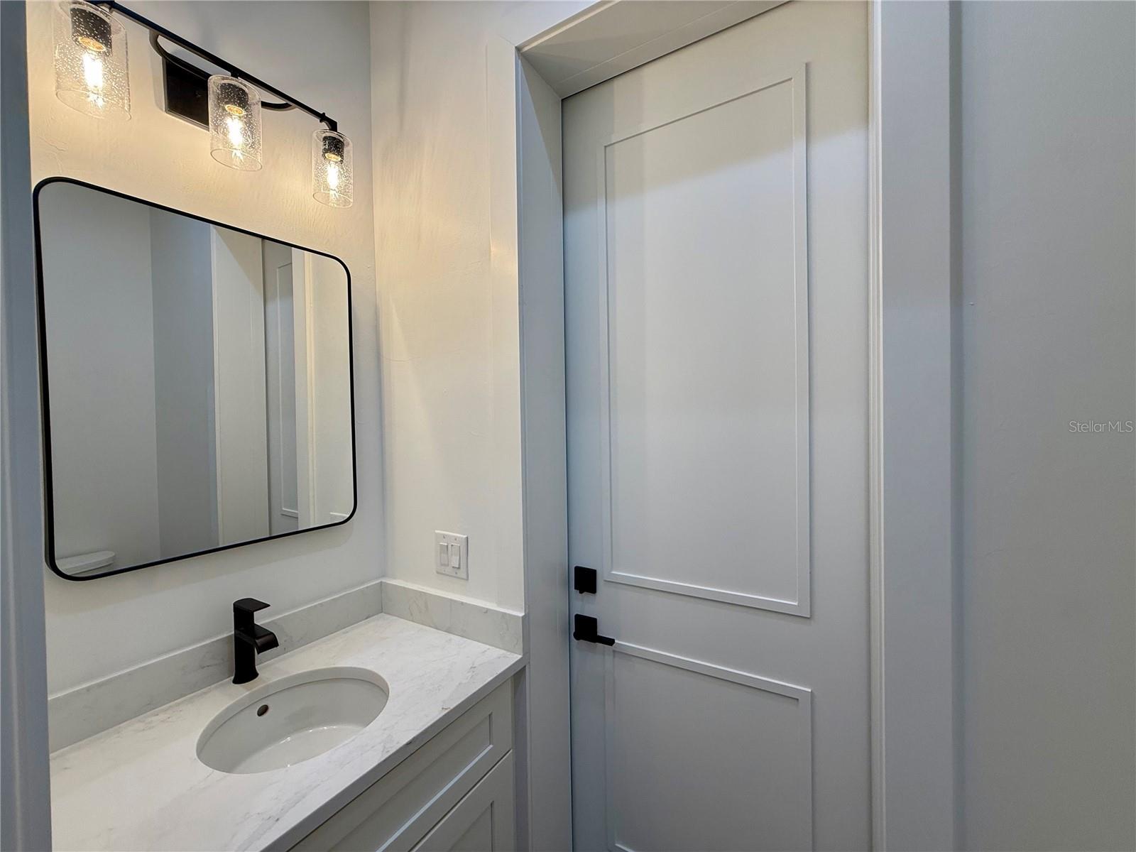 Half-Bath with door to lanai