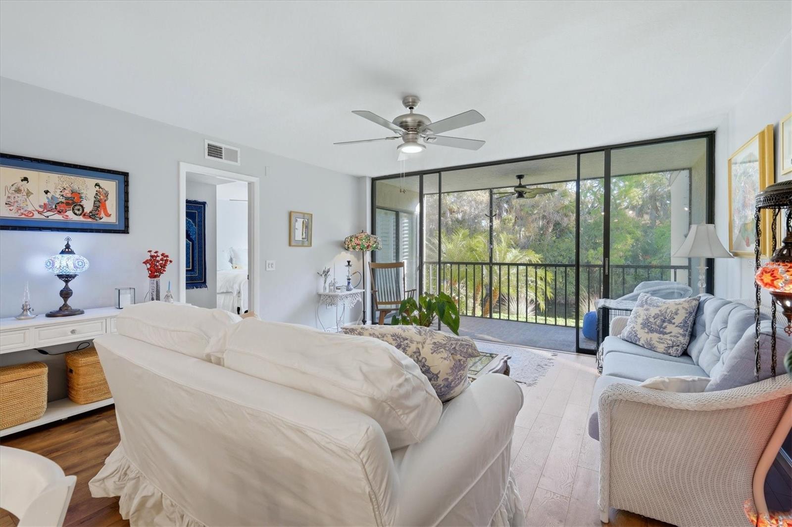 Full wall of glass overlooking serene, lush greenery and water views full of wildlife