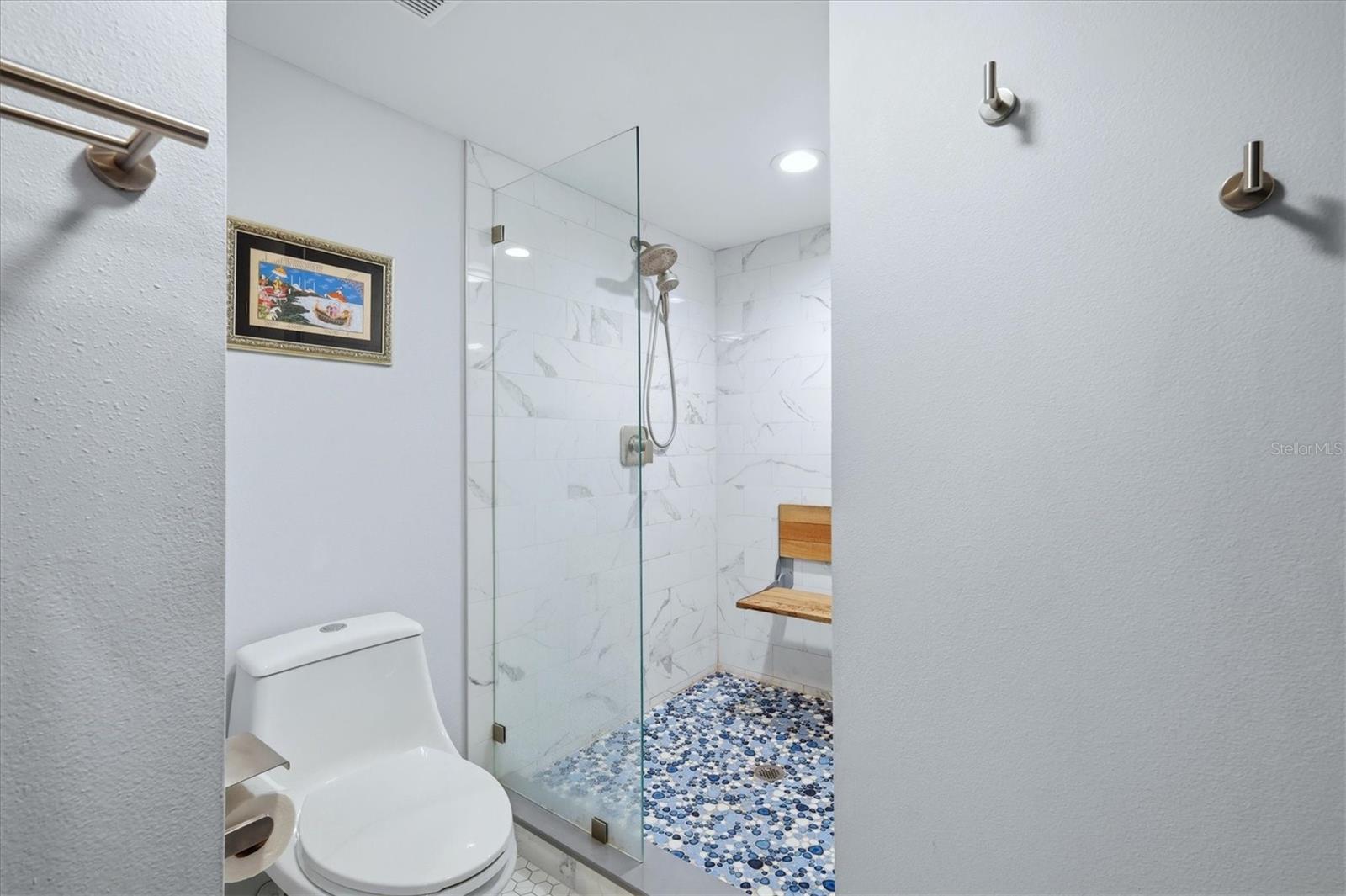 Gorgeous walk-in shower with benchseat